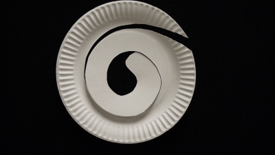 Paper plate cut into the shape of a snake