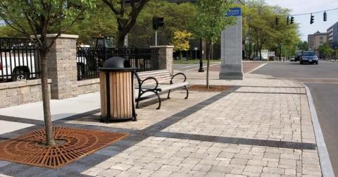 Hardscaping: Benches, planter fences, and waste receptacles.